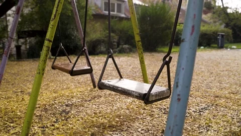 Medium shot of swing moving alone during autumn, Zagreb, Croatia. Stock Footage 145966696