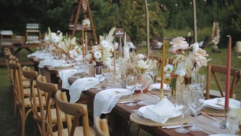 Medium shot of table served and decorated with candles and dried and pastel Stock-Footage 228570455