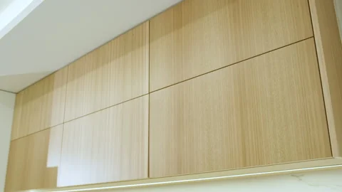 Medium shot of tall light wood cabinets with minimalist design Stock Footage 342473338