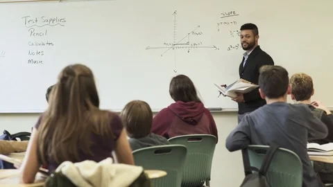 Medium shot of teacher holding math class 動画素材 73299235