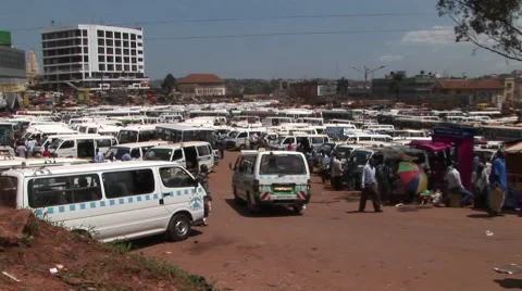 Medium shot time lapse of a busy bus depot in Kampala, Uganda. Stock Footage 67585560