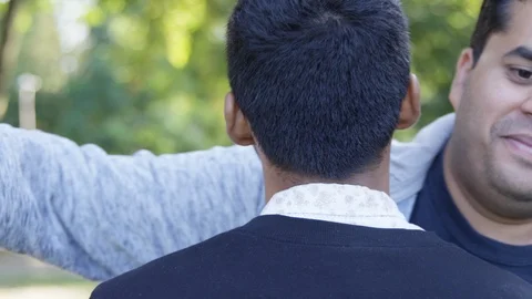 Medium Shot - Two people hug each other - Slow Motion - shot on RED Stock Footage 125093418
