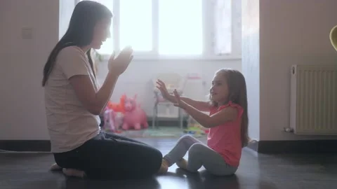 Medium Shot Two People Mother And Daughter Playing Clapping Game Inside Stock-Footage 333190366