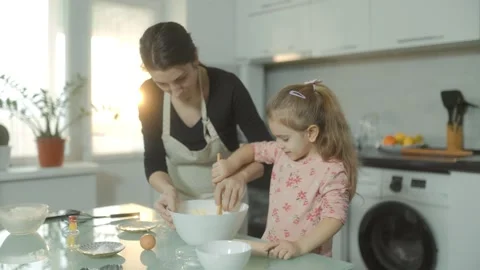 Medium Shot Two People Mother and Daughter Kneading Bread Dough Surreal Stock Footage 334037943