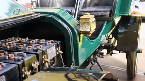 Medium shot of vintage green Baker Electric car side view, brass lantern Stock-Footage 347096947