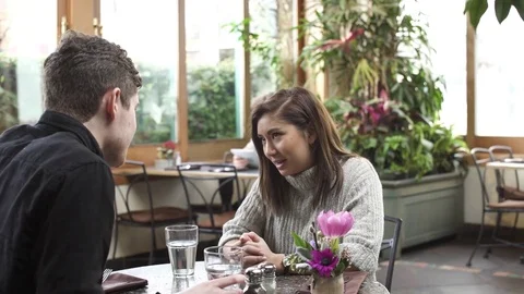 Medium shot of a waitress serving food for a couple Video stock 73303445