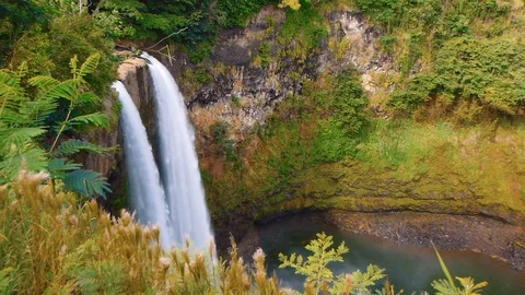 Medium Shot of Water Flowing Over Wailua Falls - Graded Stock Footage 94774032