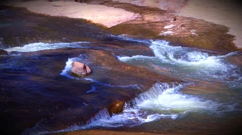 Medium Shot of Water running down Slide Rock Stock Footage 60796751