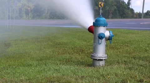 Medium Shot of Water Spraying from Fire Hydrant Stock Footage 52888826