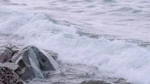 Medium shot of wave crashing over rocks, Northwest-Territories, Canada Stock Footage 244646609