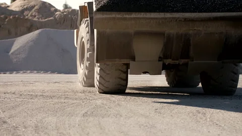 Medium Shot Of A Wheel Loader Moving Forward On A Dusty Road Stock Footage 141999066