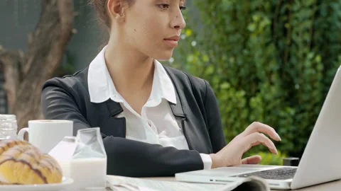 Medium shot of young attractive professional woman updating her social media pla Stock Footage 199633523