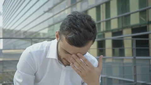 Medium shot of young Caucasian manager suffering from headache Stock Footage 97920548