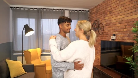 Medium shot of young couple dancing together. Stock Footage 119301876