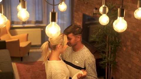 Medium shot of young couple dancing together. Stock Footage 119302387