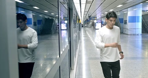 Medium shot of young man doing freestyle street dancing in underground station, Stock Footage 106384552