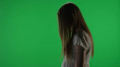 Medium side view green screen, chroma key shot of a posessed female figure Foto stock