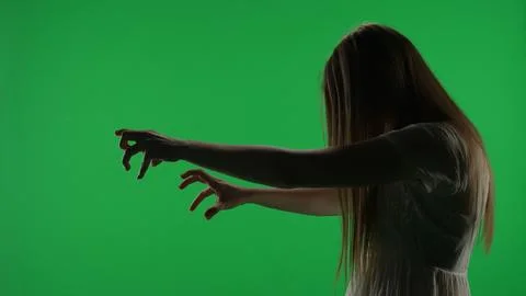 Medium side view green screen, chroma key shot of a posessed female figure Stock Photos