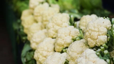 Medium size cauliflower heads kept for selling at the vegetable market Stock-Footage 286246660