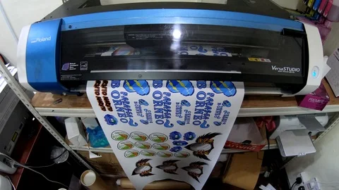 Medium size Modern Printer Makes Bright Colored Picture for garment manufacture Stock Footage 106865942