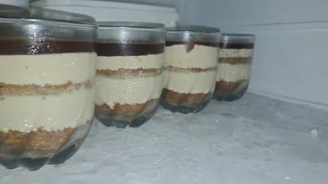 Medium-sized mirrored glasses stored in a fridge Stock Footage 316523300