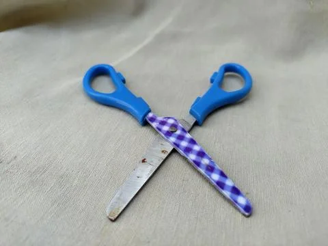 Medium sized paper scissors with light blue handles Stock Photos