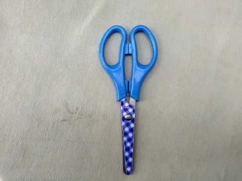 Medium sized paper scissors with light blue handles Stock Photos