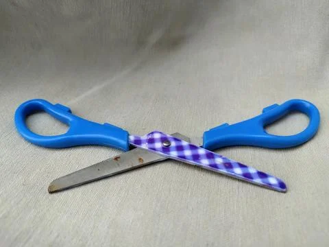 Medium sized paper scissors with light blue handles Stock Photos