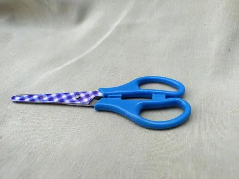Medium sized paper scissors with light blue handles Stock Photos