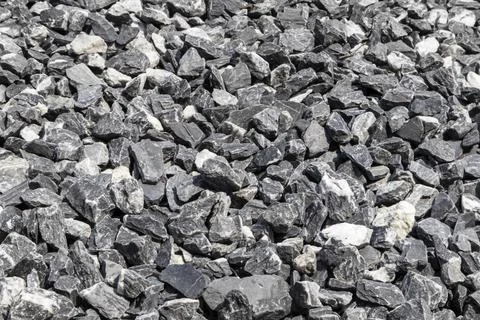 Medium sized rocks used in gardens or garden paths. Close-up focus view. Stock Photos