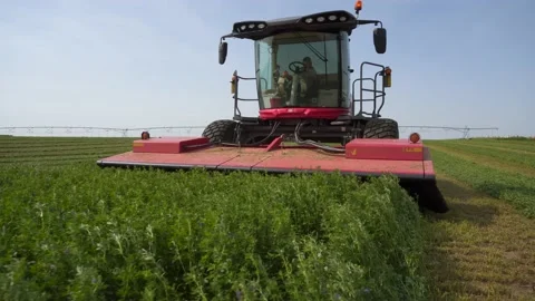 Medium Slide Back of a Swather Stock Footage 221863068
