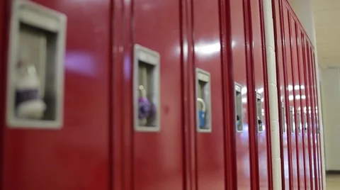 Medium slider shot to padlock on red lockers Stock Footage 41454378