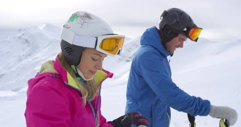 Medium Slow Mo Of Couple Preparing To Go Skiing Stock Footage 139403721
