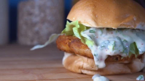 Medium Slow Motion Shot of Fish Cake Sliders with Dripping Sauce Stock Footage 113396155