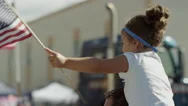 Medium Slow Motion Shot Of Girl Waving American Flag At Parade / American Fork, Stock Footage
