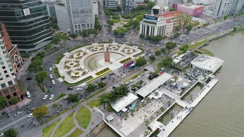 Medium-Slow Pan over HCMC's Saigon River. Busy Road. Ferry Station and People. Stock Footage 211818964