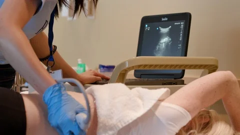 Medium sonographer scanning back Stock Footage 114181258