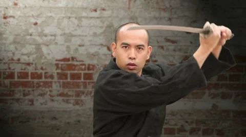 Medium Sword Draw and Cuts on Zooming Brick Wall Stock Footage 10812752