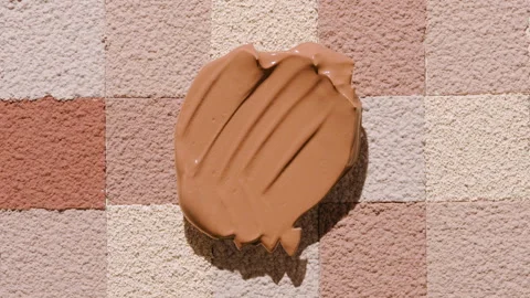 Medium tone foundation shadow on skin tone mosaic surface Stock Footage 339387076