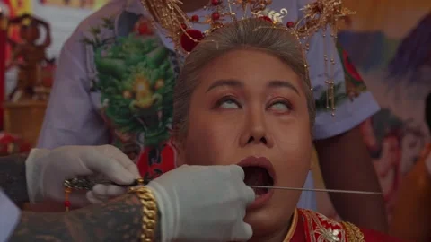 Medium in Trance Preparing for Facial Piercing in Phuket Festival Stock Footage 345536958