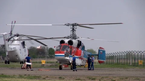 Medium transport helicopter Ka-32 on helipad with running engines. Stock Footage 118647461
