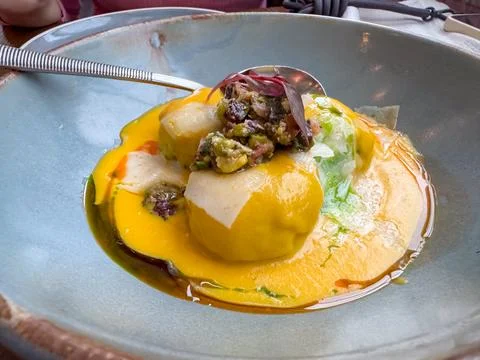 Medium venison stake slices served with pumpkin soup in an Italian restaurant in Stock-Fotos