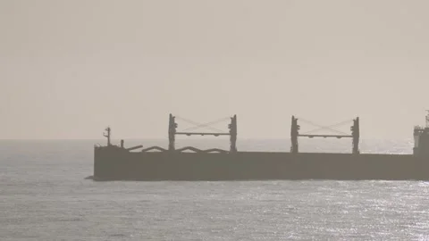 Medium View of Empty Cargo Ship Out at Sea Heading to Nearest Port to Collect Video stock 345006074