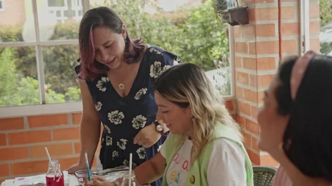Medium view of hispanic or latin american women talking outside as they Stock Footage 266444913
