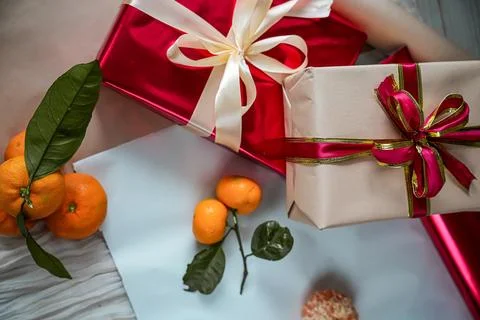 Medium View of Red and Beige Gift Boxes with Tangerine Stock Photos