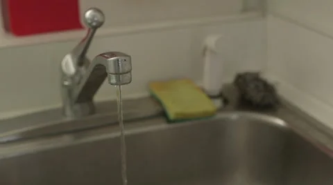 Medium of Water running slowly out of faucet Stock Footage 45921633