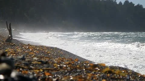 Medium waves hitting shore with mist Stock Footage 10746768