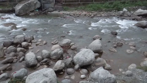 Medium, white water stream flows through a rocky bed, Kangra, India Stock Footage 140447924