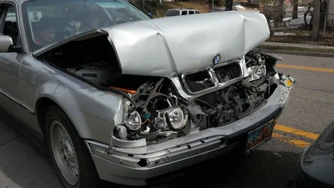 Medium Wide Shot Tilt Up Crashed BMW Stock Footage 87038579