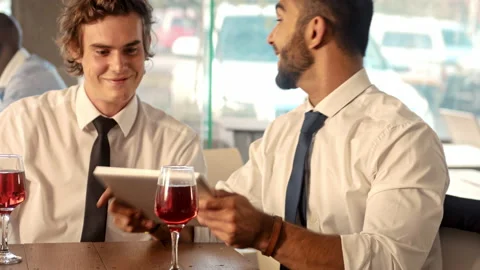 Medium of a young multicultural starting out businessman signing loan agreement Stock Footage 199634162